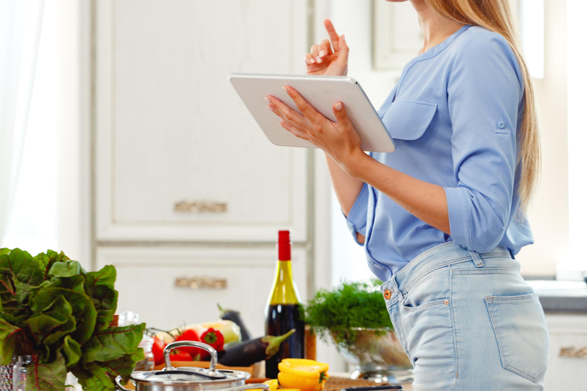 organized plated dishes and shopping list on tablet